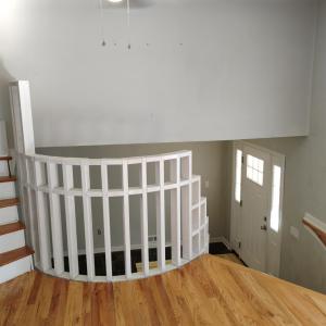 VIEW STANDING IN LIVING ROOM LOOKING DOWN AT FRONT DOOR