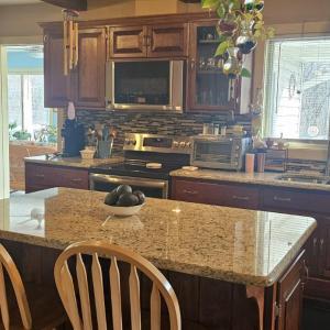 Large kitchen with granite & Stainless-Steel appliances