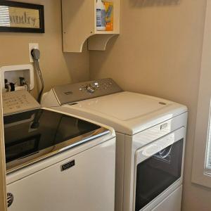 Laundry room w/ pocket door off of primary bathroom isso convenient. This area isl also accessible off of sunroom