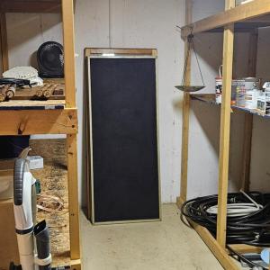 Storage closet off of recreation room has 3 walls of concrete & could make an incredible safe room.