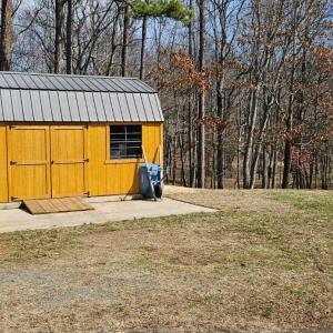 Beautiful new tool shed. Would make a great "She Shed"! The "He Shed" is the huge, detached garage!
