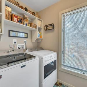 Laundry room located off primary bathroom