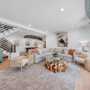 Terrace level, covered entertaining space is perfect for a quiet retreat for your guest and family!