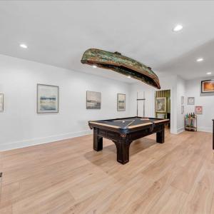 Wet bar and game room come fully equipped for immediate occupancy!