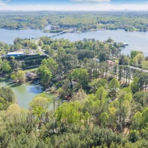 Tucked away in a private uncluttered cove perfect for floating and family fun! The brand new contemporary dock will be completed by spring! Renderings are available to serious buyers!