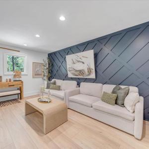 Enter the upper level loft/living room, full bath and 2 additional bedrooms each with access to the upper covered deck overlooking the lake!