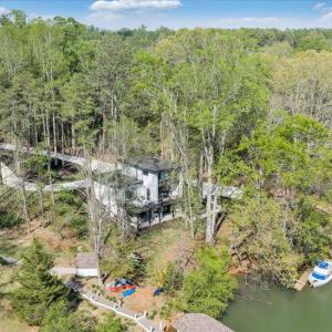 Tucked away in a private uncluttered cove perfect for floating and family fun! The brand new contemporary dock will be completed by spring! Renderings are available to serious buyers!