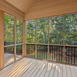 Screened in porch with TV and surround sound outside exterior.