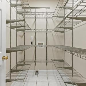 Walk-in pantry off to kitchen.  It is wired and plumbed for a main level laundry room.  There is a laundry room on all three levels!