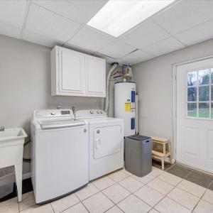 Separate laundry room in basement level