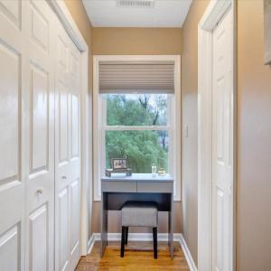 Primary bedroom with nook for a desk, dressing table or other small accent furniture