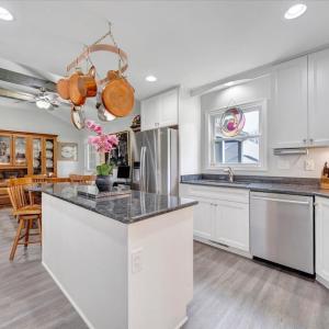 Kitchen in the addition with granite countertops and island