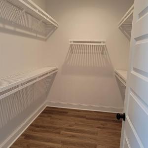 Primary closet (Similar to photo)