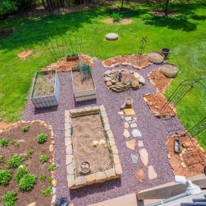 This food  garden is ready and waiting for you! It has had years of producing tomatoes and cucumbers on the trellis, lettuces , broccoli, eggplant, peppers, beets, and so much more in the beds. It has a 6 year old asparagus bed. Two rings for potato growing. It is fantastic!