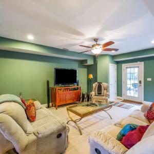 Terrace level great room with built in bookcase, closet and door to terrace garden and patio