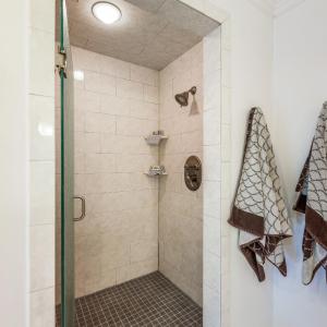 Primary shower room with two shower heads!
