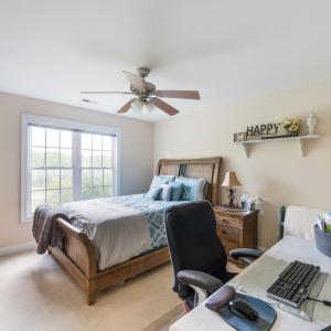 Large bedroom with walk in closet, private sink, and jack and Jill toilet and bath.