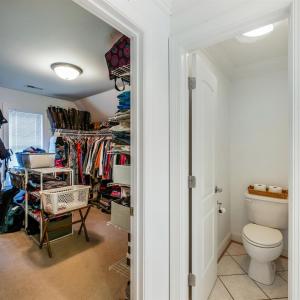 Primary bedroom with large walk in closet and private toilet room