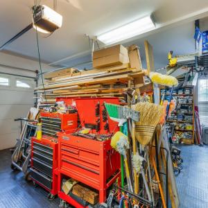 Three bay garage, workshop area with built in cabinets, and fantastic slip proof flooring