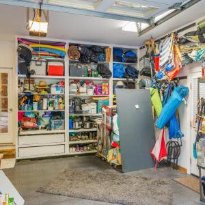Three bay garage, workshop area with built in cabinets, and fantastic slip proof flooring