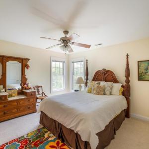 Bedroom with private sink and jack and Jill toilet and bath.