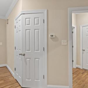 Coat closet to the left.  Entry to main level full bathroom and three car garage entry.