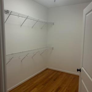Spacious walk in closet in primary bedroom.
