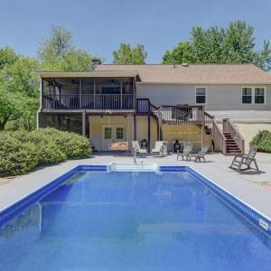 Large fenced pool area with extended pool apron and patio for entertaining.
