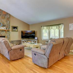 Familiy/Living Room with Rock Fireplace, Gas Logs, hardwood floors.