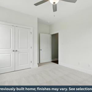 Bedroom 4 with carpet and ceiling fan