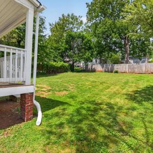 Fresh and bright bungalow with charming covered front porch.