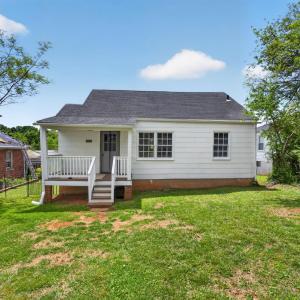 Covered back porch. Beautiful open, flat backyard. fully fenced and ready to garden or add a play yard! Wonderful for hosting.
