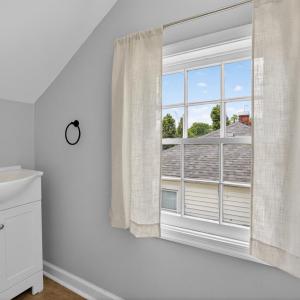Upstairs half bath, fully updated, including window view.