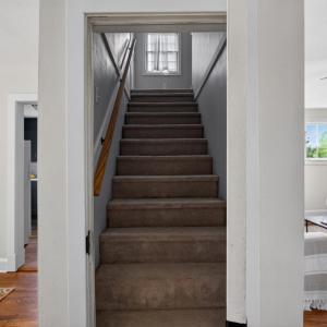 Door leading upstairs to a fully private loft bedroom.
