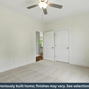 Bedroom 2 with carpet & ceiling fan