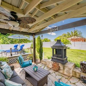 Covered poolside patio creating the perfect space for year-round entertaining and relaxation.