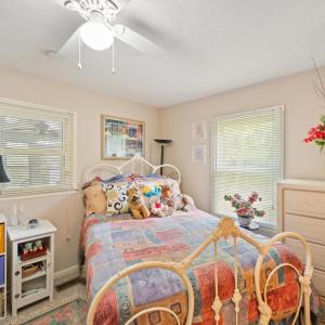Private bedroom situated adjacent to the home office, ideal for guests or a private workspace suite.