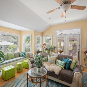 Gorgeous sunroom with walkout to pool. Lots of natural light!