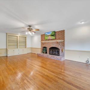 Huge rec room with fireplace.  This room can be closed off by doors from the remainder of the home.  You can make good use of the built-ins