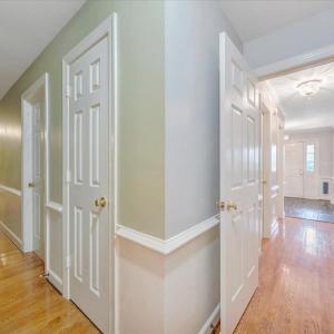 Hallway off the foyer and hallway leading to the bedroom area