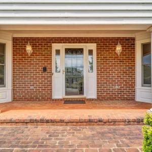 A large brick porch welcomes you