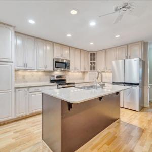 Beautiful kitchen with stainless appliance, including a new dishwasher.