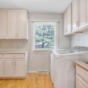 Nice laundry room off the kitchen with additional cabinet space