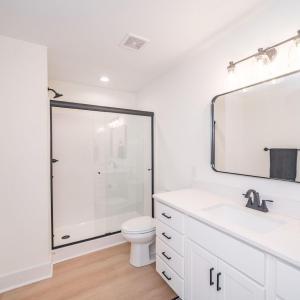 Primary bath offers shower with glass door.  Similar to photos.