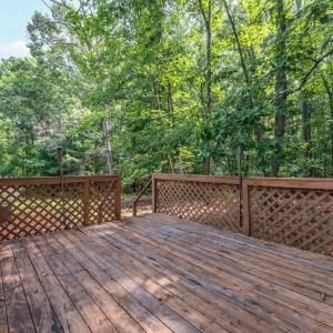 The 12x16 deck is on the back accessed from double slider glass doors at the end of the Sunporch; with stairs to the yard.