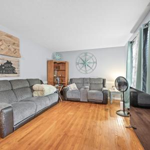 The living room is just off the front door entrance