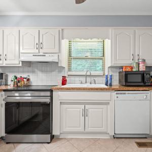 There are cabinets on the wall opposite this too. Convection oven 8 months old. DW 10 years old