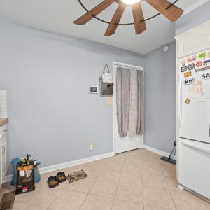 Opposite the kitchen sink. this is the door to the Sunroom
