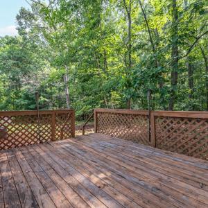 The 12x16 deck is on the back accessed from double slider glass doors at the end of the Sunporch; with stairs to the yard.