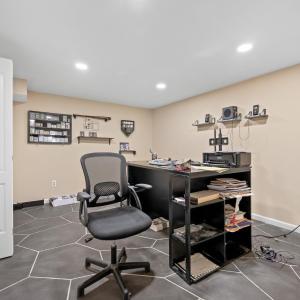 Downstairs office or bedroom. No window in this room. There is a window at the bottom of the stairs just outside the room with legal egress window